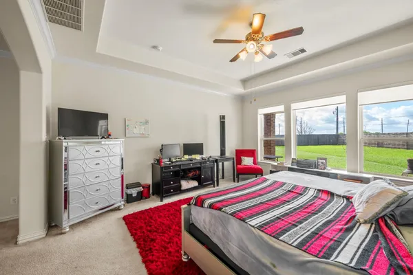 a bed room with a bed and a chandelier
