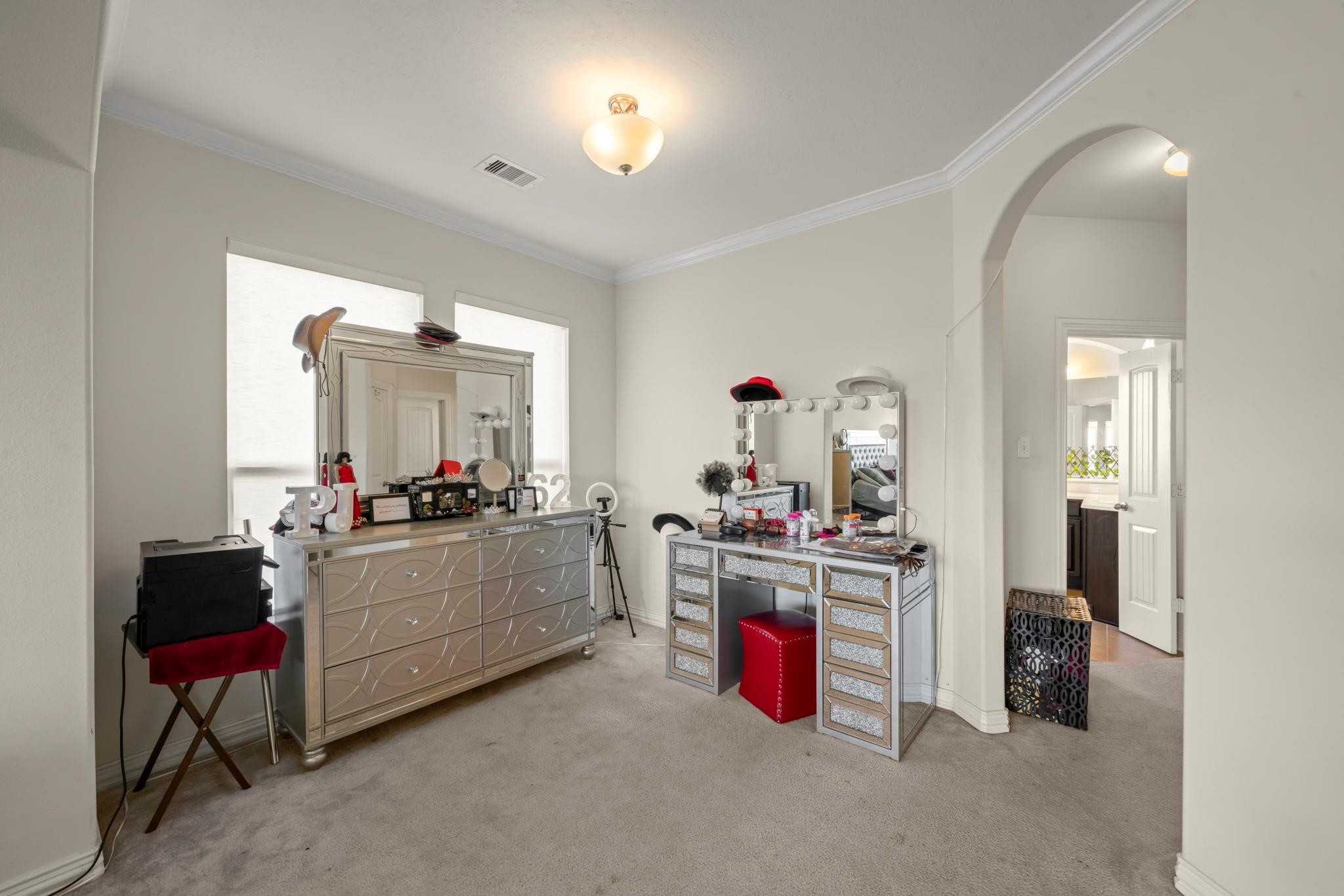 9939 Clear Diamond Drive Rosharon, TX 77583 - Photo 19 of 30 a room with kitchen island a stove a sink and a refrigerator