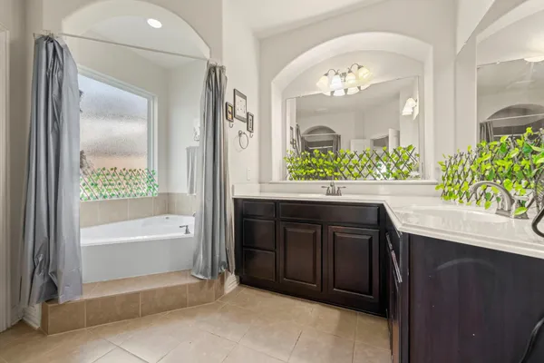 a bathroom with a glass shower door
