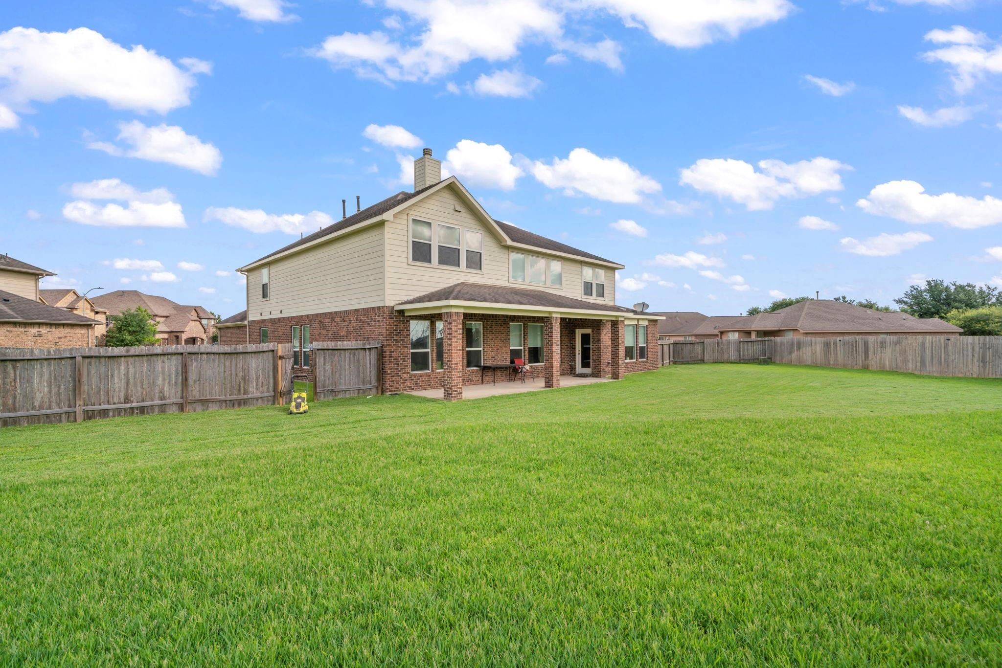 9939 Clear Diamond Drive Rosharon, TX 77583 - Photo 23 of 30 a view of a house with a yard and sitting area