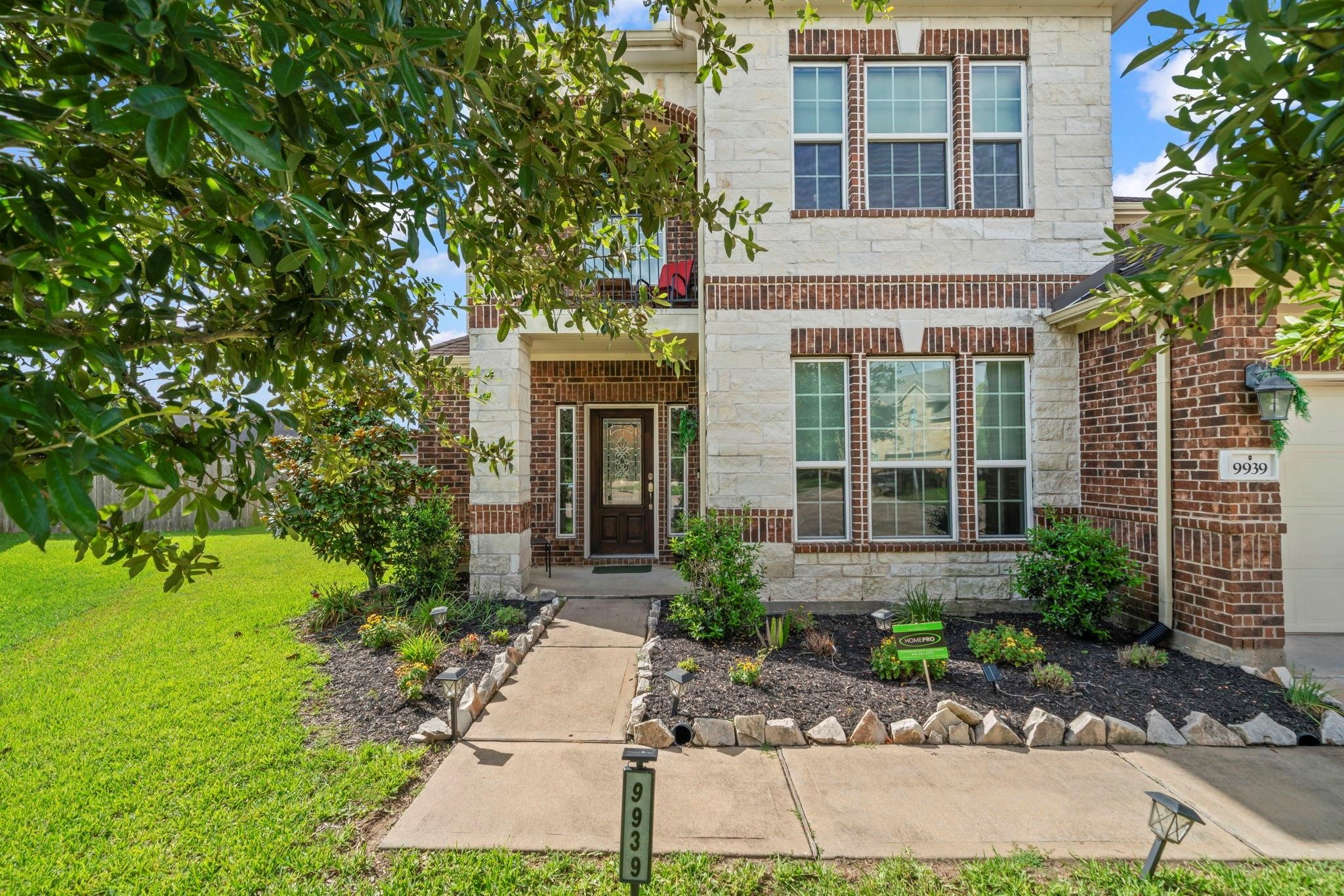 9939 Clear Diamond Drive Rosharon, TX 77583 - Photo 29 of 30 a front view of a house with garden