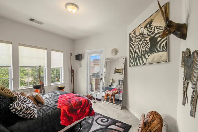 a bedroom with bed and a window