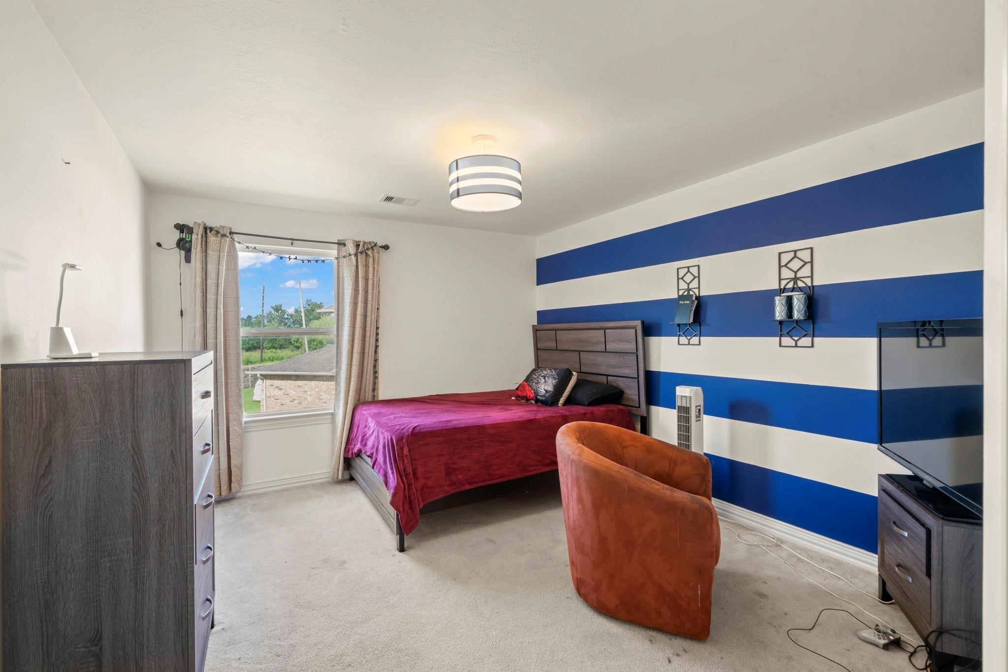 9939 Clear Diamond Drive Rosharon, TX 77583 - Photo 8 of 30 a living room with furniture and a ceiling fan
