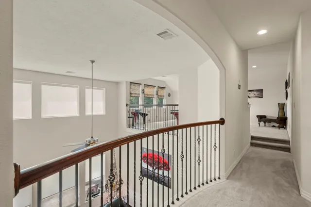 a view of a hallway with a living room