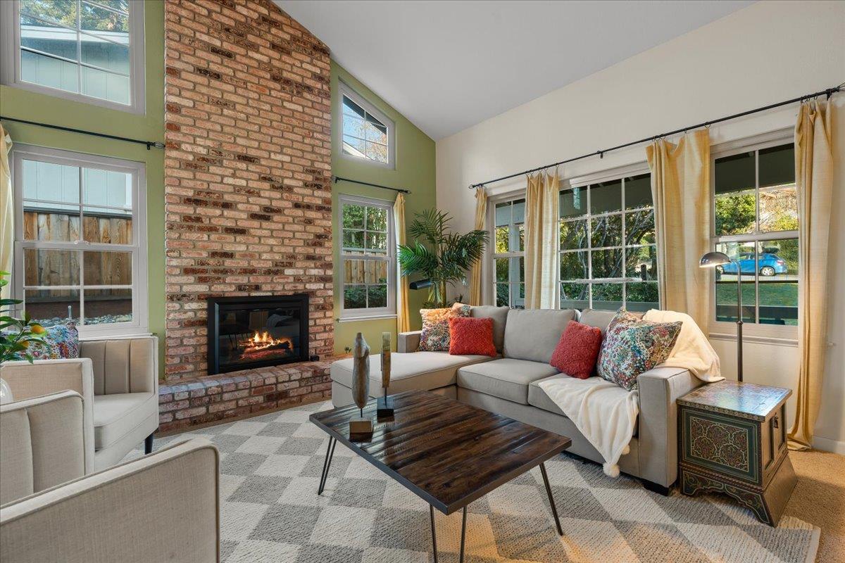 16715 Trail Drive Morgan Hill, CA 95037 - Photo 12 of 45 a living room with furniture a fireplace and a floor to ceiling window