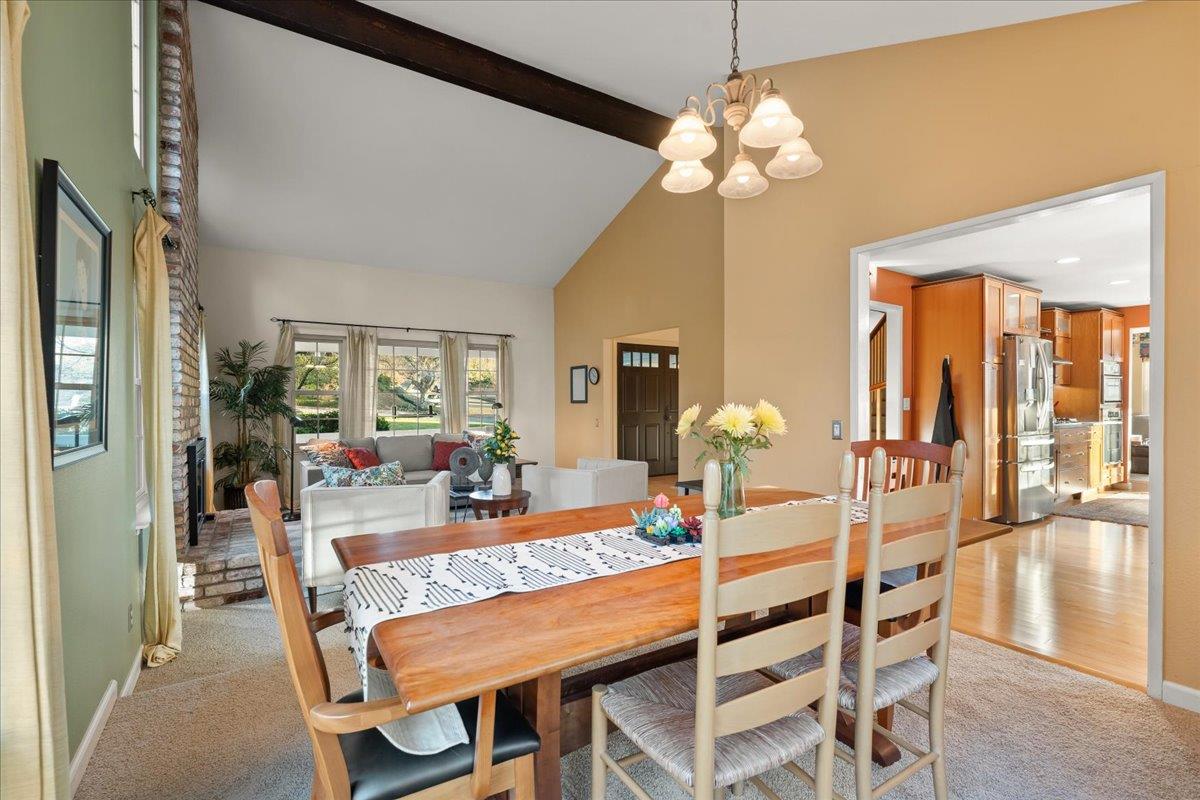 16715 Trail Drive Morgan Hill, CA 95037 - Photo 16 of 45 a dining room with wooden floor a chandelier a wooden table and chairs