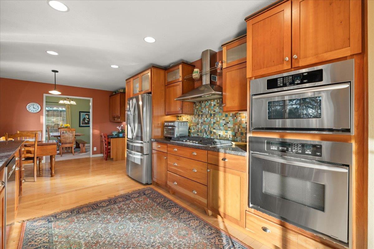 16715 Trail Drive Morgan Hill, CA 95037 - Photo 20 of 45 a kitchen with stainless steel appliances granite countertop a stove a sink and a microwave