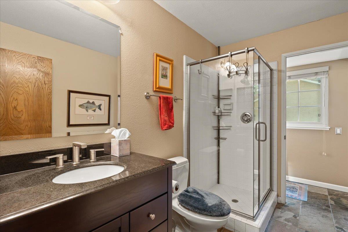 16715 Trail Drive Morgan Hill, CA 95037 - Photo 24 of 45 a bathroom with a granite countertop sink mirror vanity and toilet