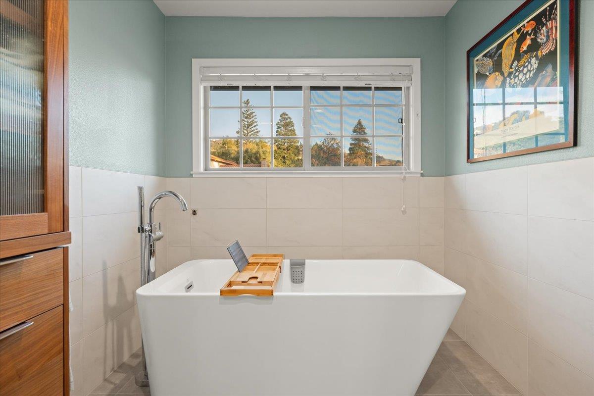16715 Trail Drive Morgan Hill, CA 95037 - Photo 32 of 45 a bathroom with a bathtub and mirror
