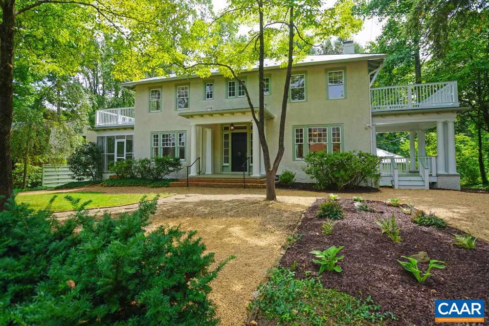 1930 Thomson Road Charlottesville, VA 22903 - Photo 1 of 35 a view of a white house with a large pool and large trees