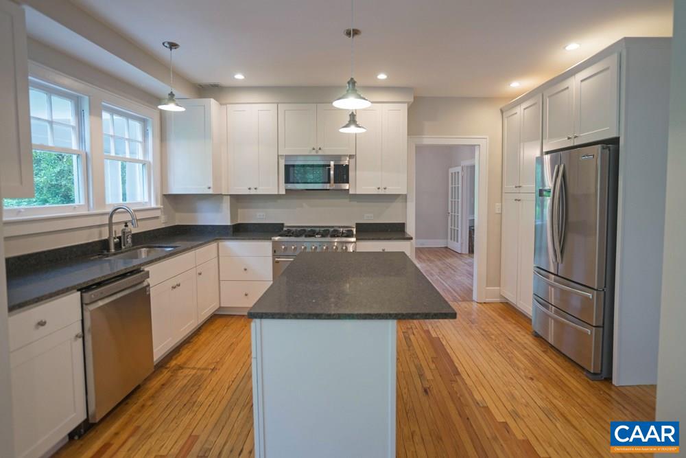 1930 Thomson Road Charlottesville, VA 22903 - Photo 11 of 35 a kitchen with stainless steel appliances granite countertop a sink a stove a refrigerator and a oven