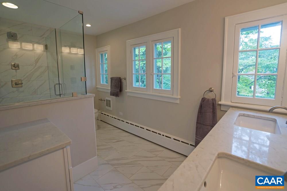 1930 Thomson Road Charlottesville, VA 22903 - Photo 18 of 35 a bathroom with a tub shower and window