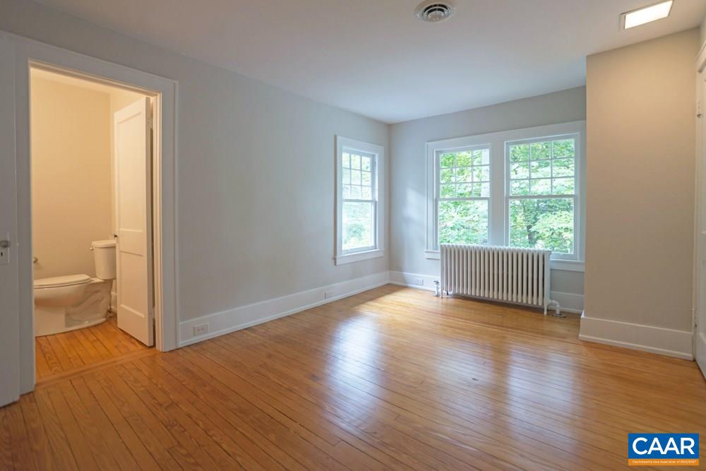 1930 Thomson Road Charlottesville, VA 22903 - Photo 26 of 35 a view of an empty room window and wooden floor