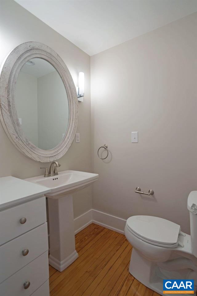 1930 Thomson Road Charlottesville, VA 22903 - Photo 27 of 35 a bathroom with a toilet a sink and mirror