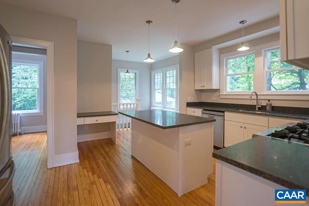 1930 Thomson Road Charlottesville, VA 22903 - Photo 10 of 35 a kitchen with granite countertop a sink a counter space appliances and a window