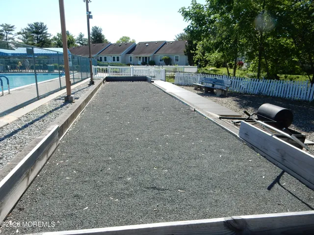 a front view of a house with lots of windows and trees
