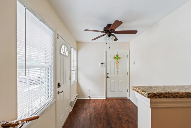 a view of a kitchen with microwave and cabinets