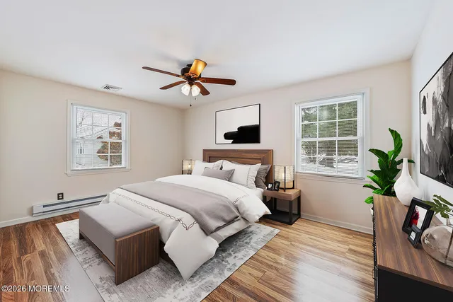 a view of a kitchen with a stove wooden floor and a window