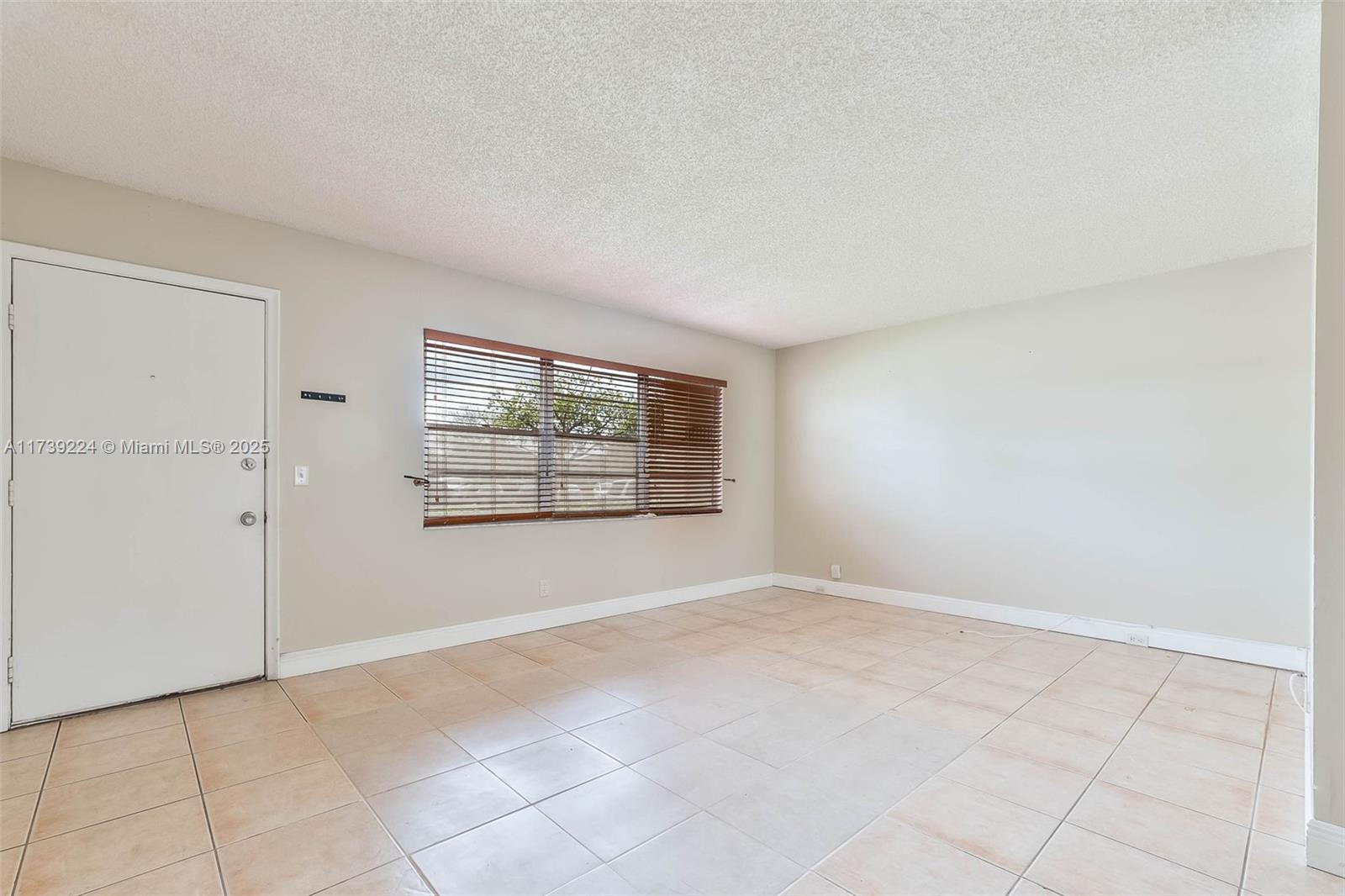13355 Southwest 9th Court, Unit 104H Pembroke Pines, FL 33027 - Photo 12 of 22 an empty room with windows