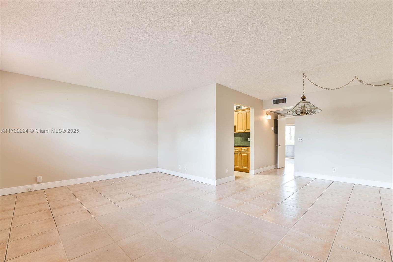 13355 Southwest 9th Court, Unit 104H Pembroke Pines, FL 33027 - Photo 14 of 22 a view of a room with an empty space
