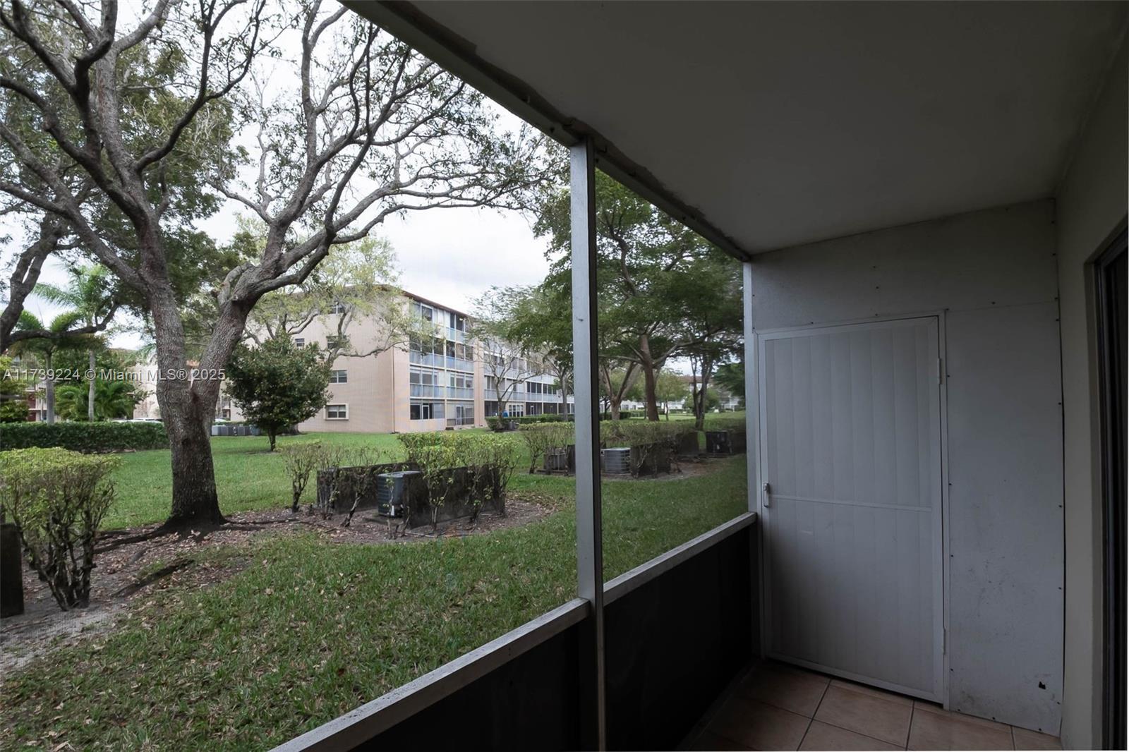 13355 Southwest 9th Court, Unit 104H Pembroke Pines, FL 33027 - Photo 16 of 22 a view of a garden from a balcony