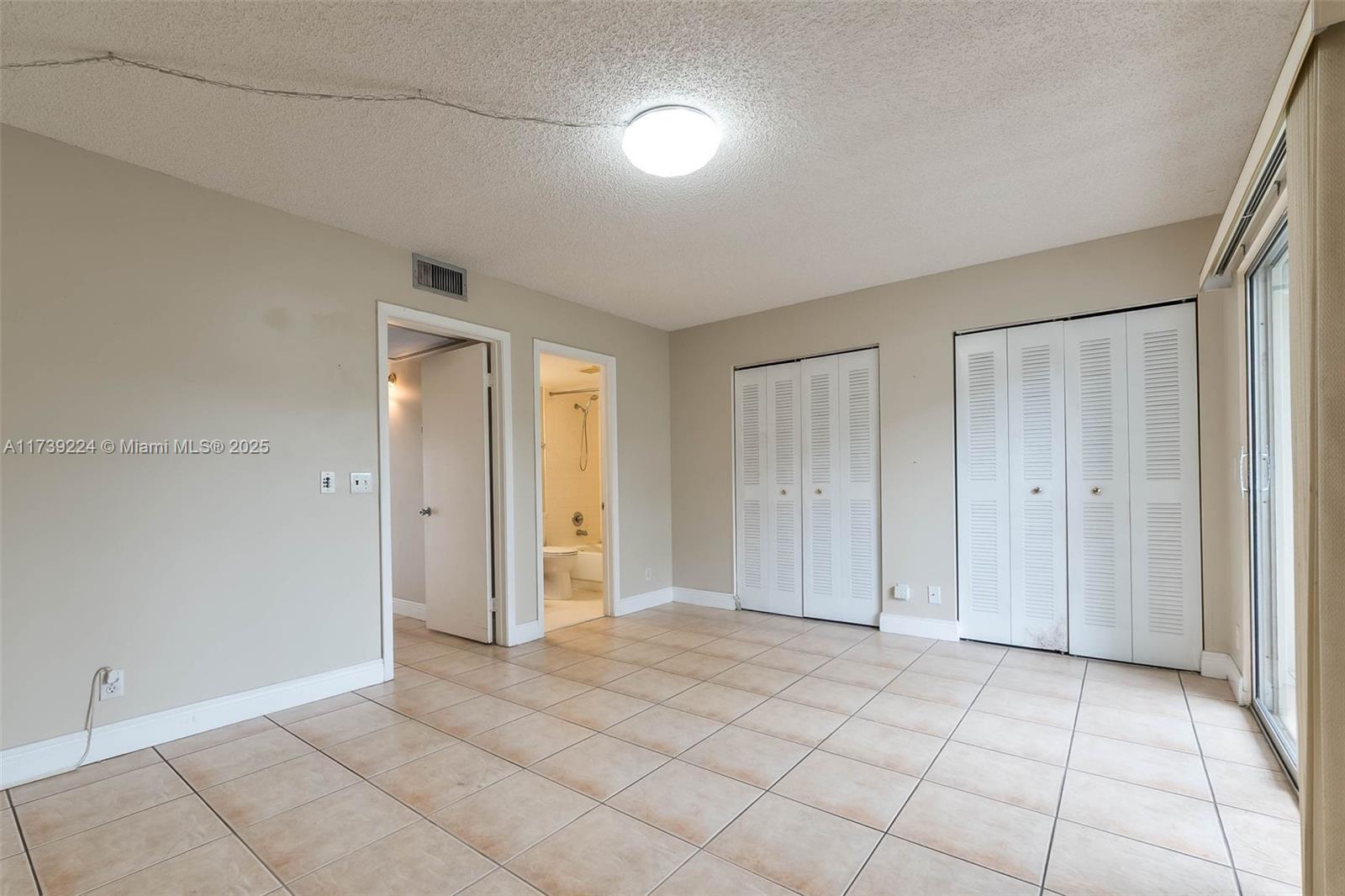 13355 Southwest 9th Court, Unit 104H Pembroke Pines, FL 33027 - Photo 7 of 22 a view of an empty room