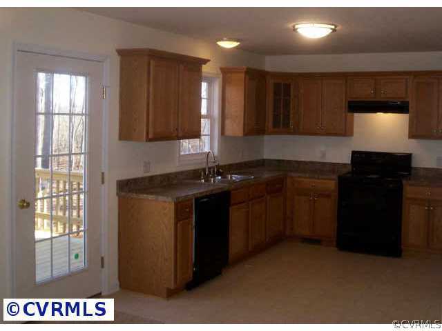 239 Old Buckingham Road Cumberland, VA 23040 - Photo 2 of 5 a kitchen with a sink and a stove