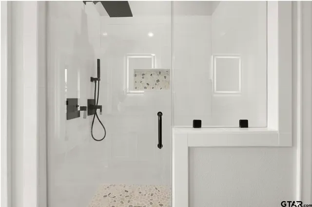 a view of closet with wooden floor