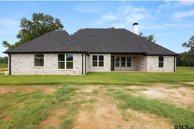a view of a kitchen with a sink and wooden floor