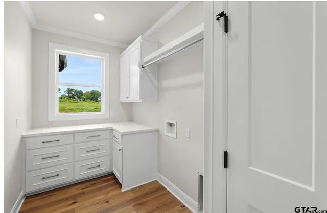 a bathroom with a window a sink and a shower