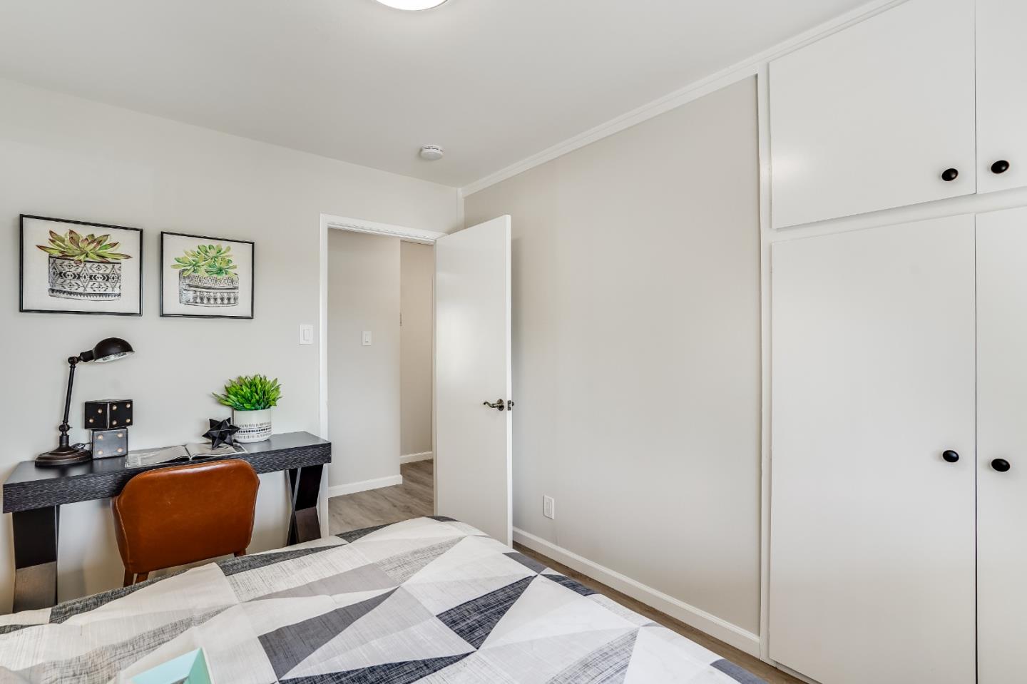 508 Mountain View Avenue Belmont, CA 94002 - Photo 13 of 38 a bedroom with bed and paintings on the wall