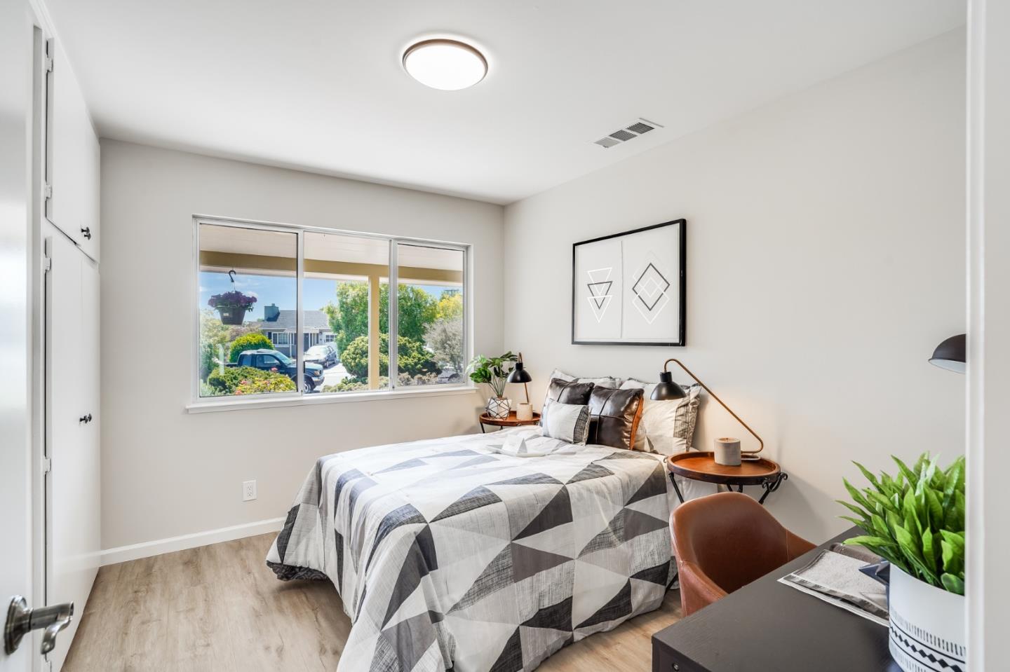 508 Mountain View Avenue Belmont, CA 94002 - Photo 18 of 38 a bedroom with a bed and a large window