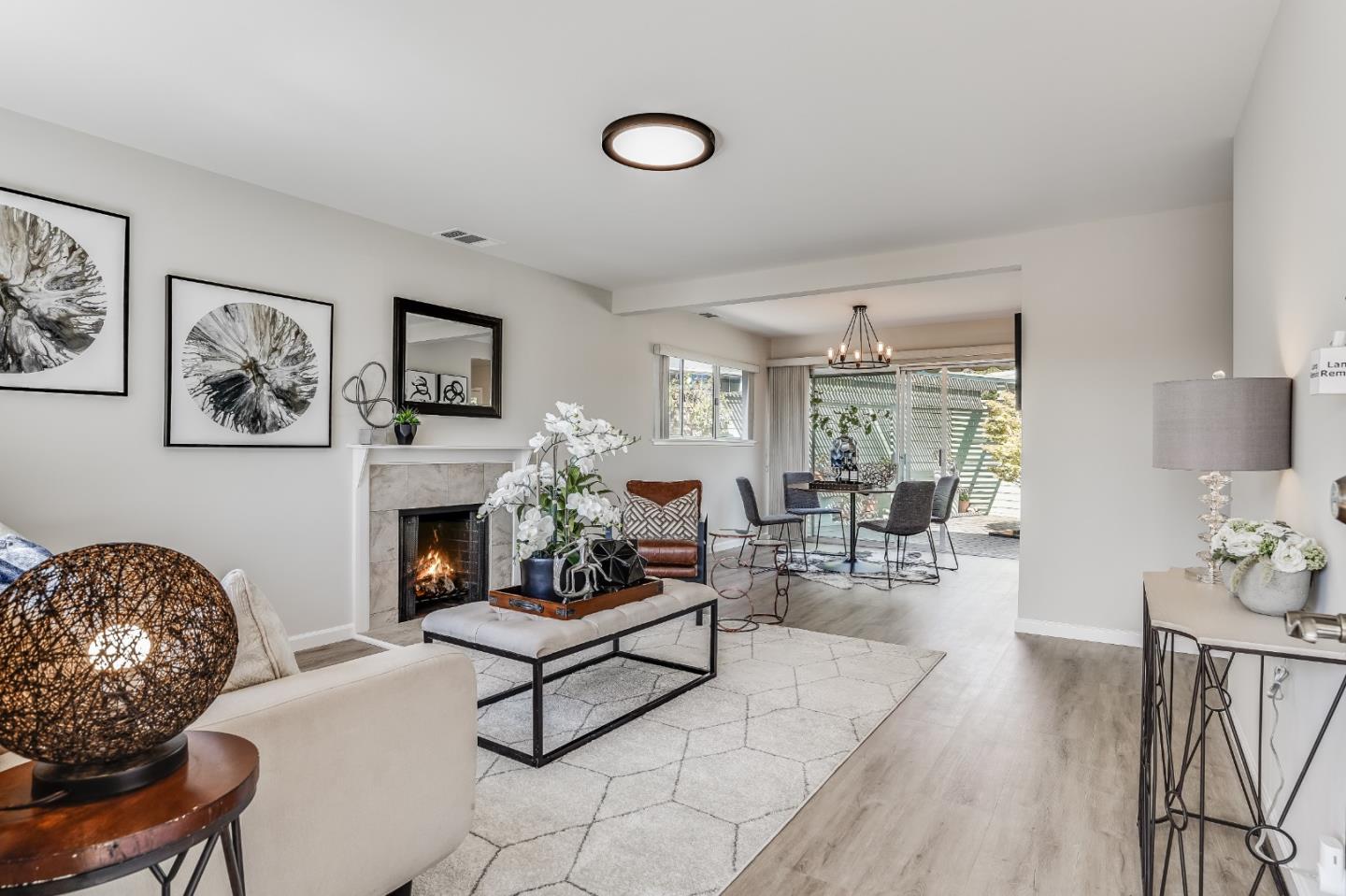 508 Mountain View Avenue Belmont, CA 94002 - Photo 2 of 38 a living room with furniture a fireplace and a table