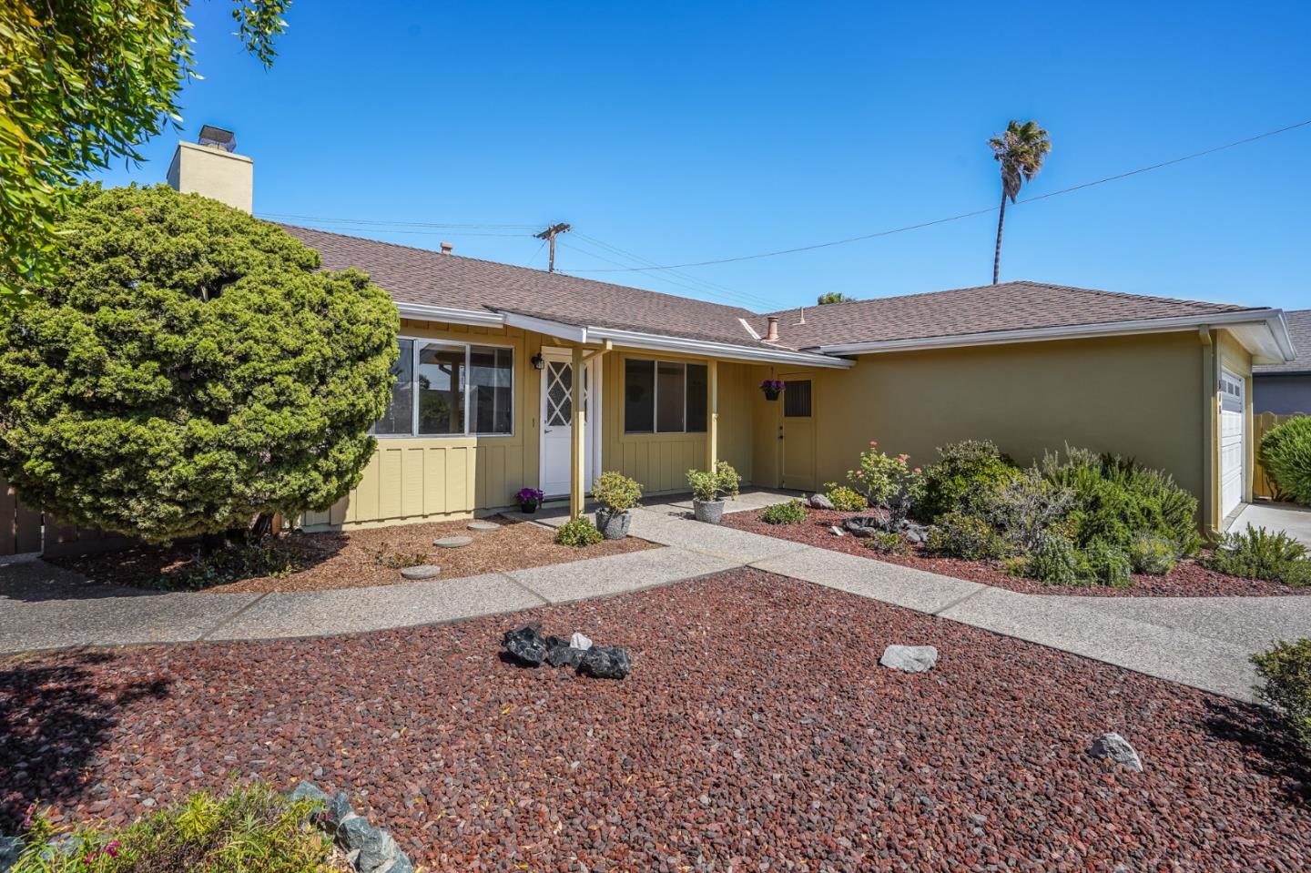508 Mountain View Avenue Belmont, CA 94002 - Photo 32 of 38 a view of a house with a yard and potted plants
