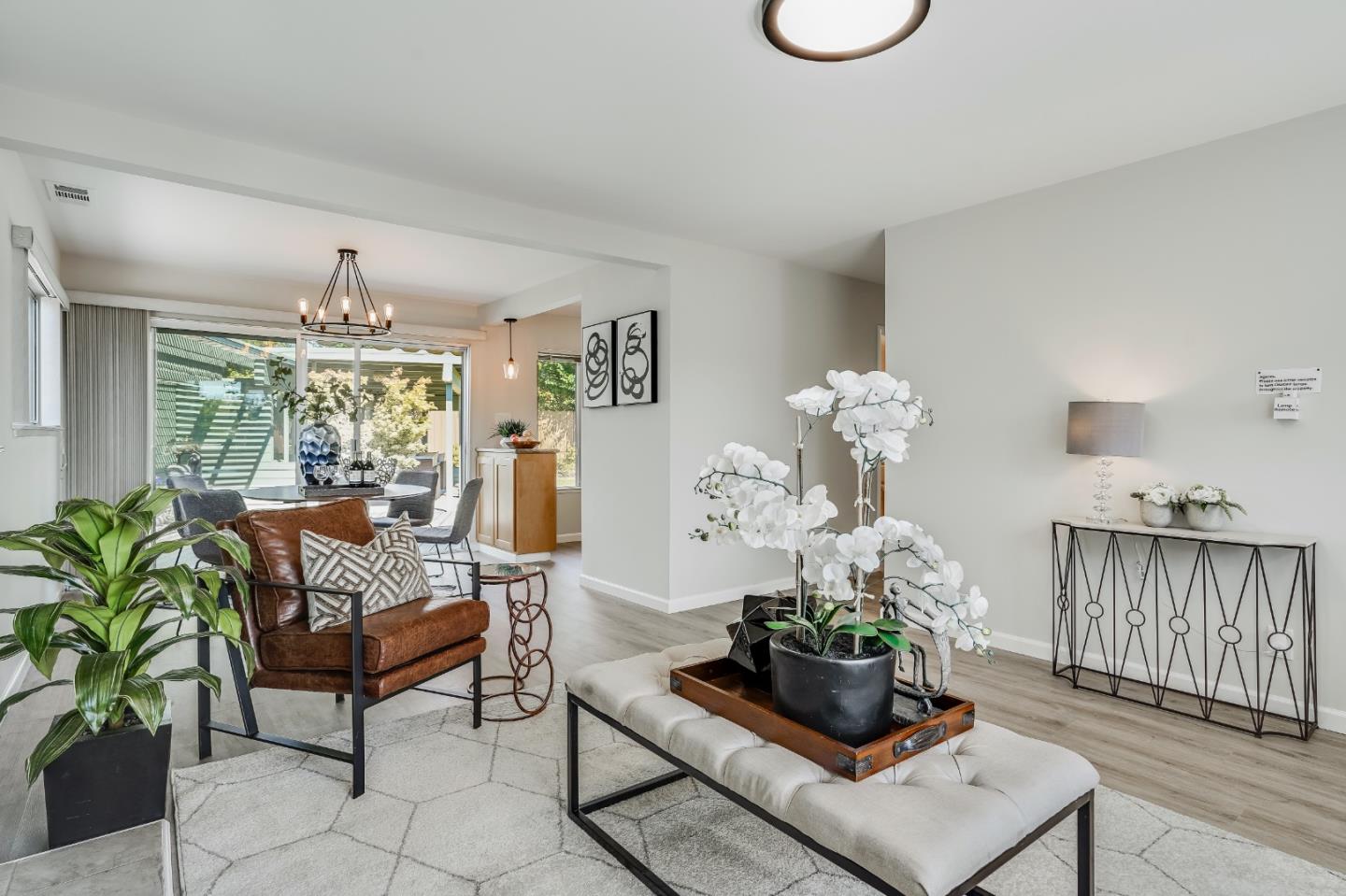 508 Mountain View Avenue Belmont, CA 94002 - Photo 4 of 38 a living room with furniture and a chandelier