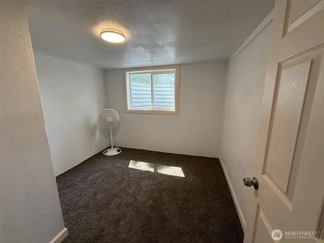 an empty room with a bathroom