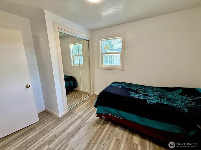 a bathroom with a sink mirror toilet and vanity
