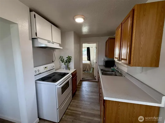 wooden floor in an empty room with stairs