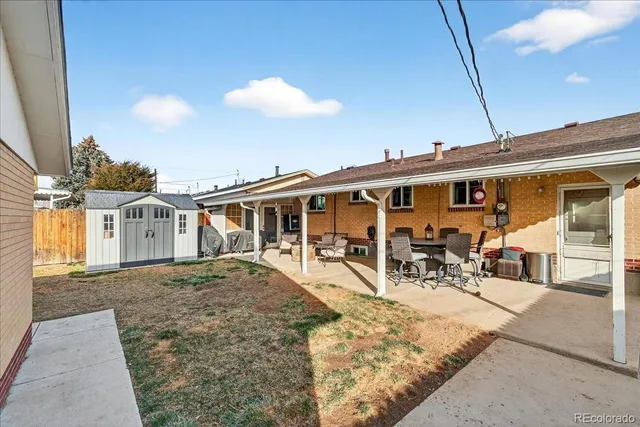 a view of a house with patio area