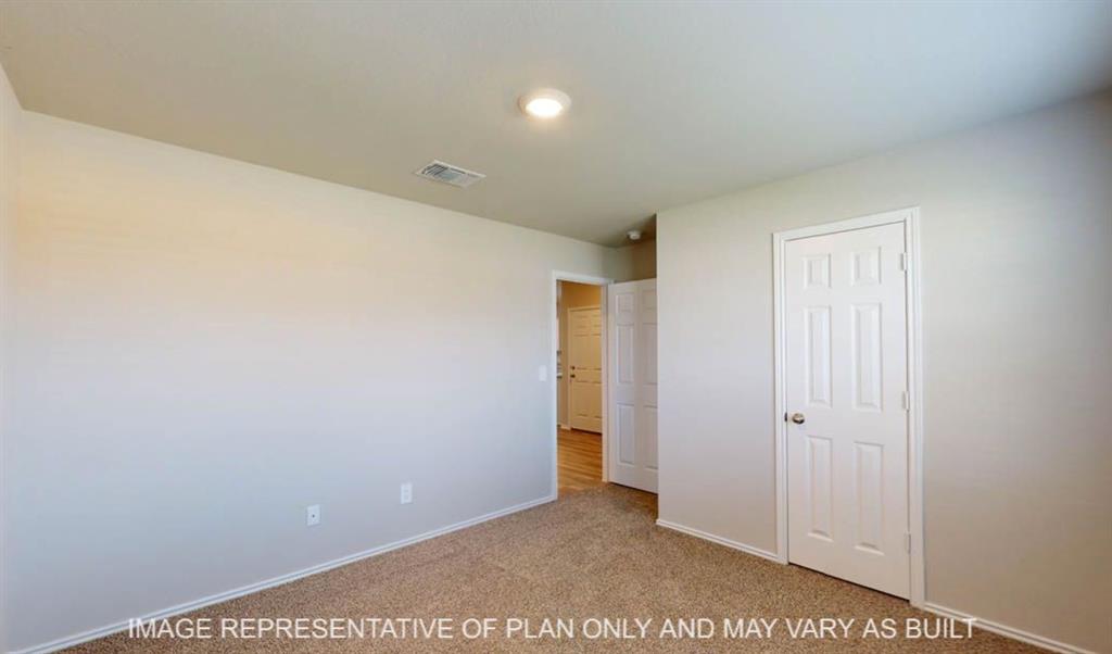 10204 Neptune Court Waco, TX 76708 - Photo 18 of 20 Carpeted room featuring light-toned walls, a white paneled door, and recessed lighting