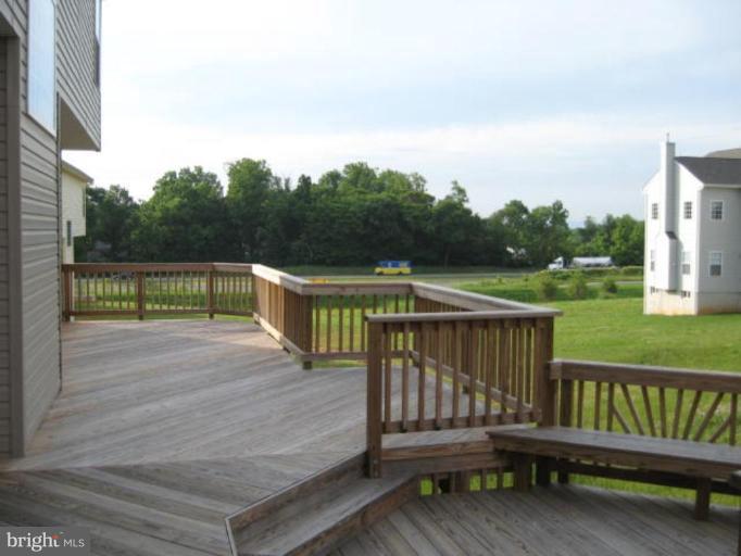 69 Boise Road Inwood, WV 25428 - Photo 3 of 8 Tiered deck with bench waiting for your hot tub!