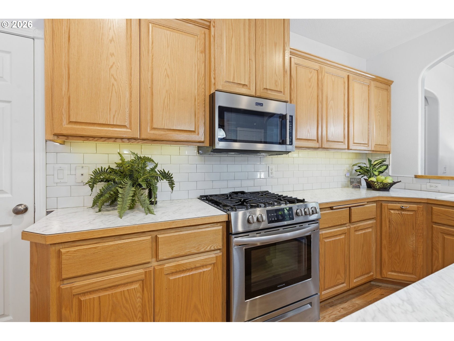 667 72nd Street Springfield, OR 97478 - Photo 15 of 40 a kitchen with cabinets stainless steel appliances and a sink