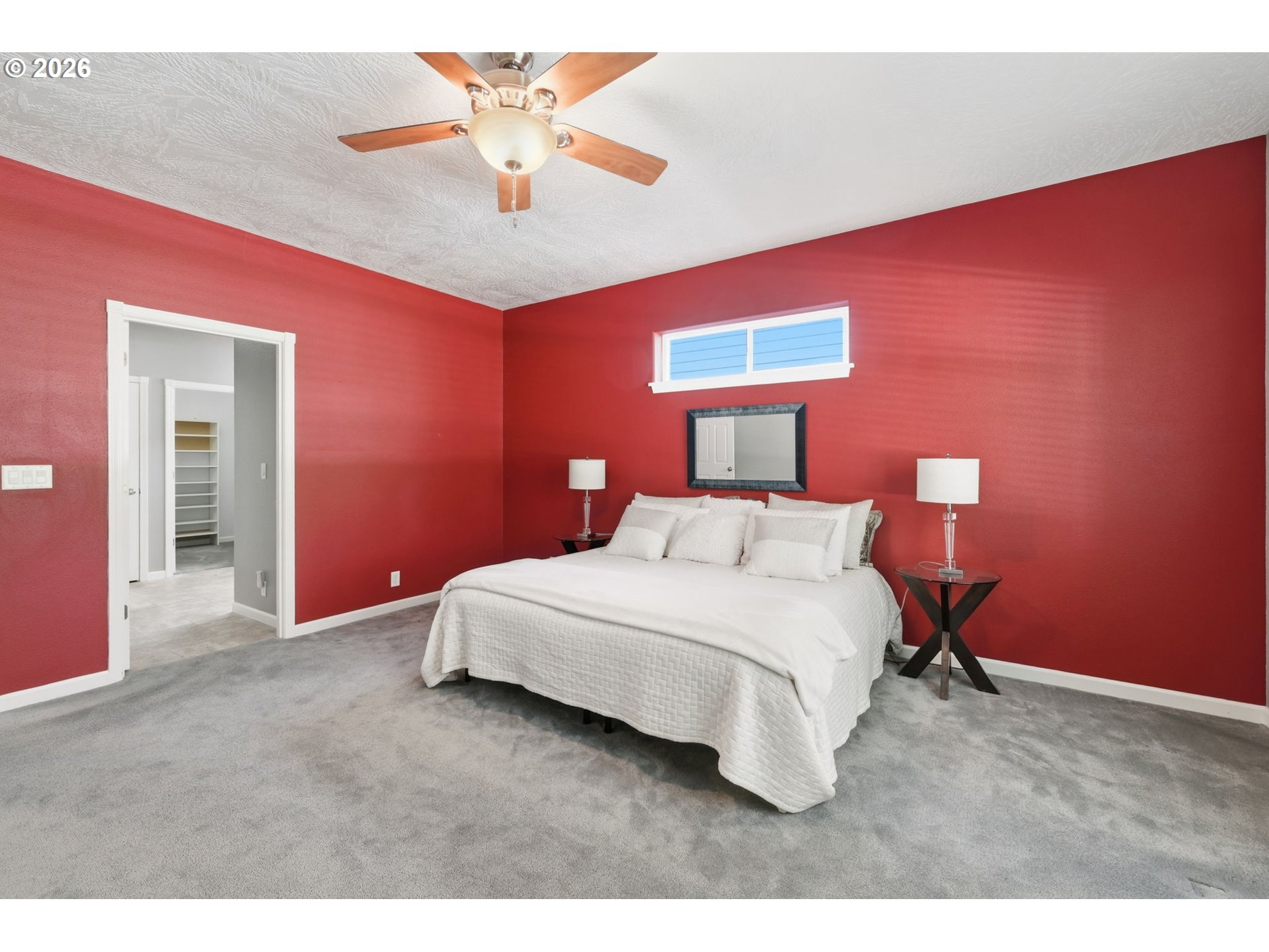 667 72nd Street Springfield, OR 97478 - Photo 19 of 40 a bedroom with a bed and a chandelier