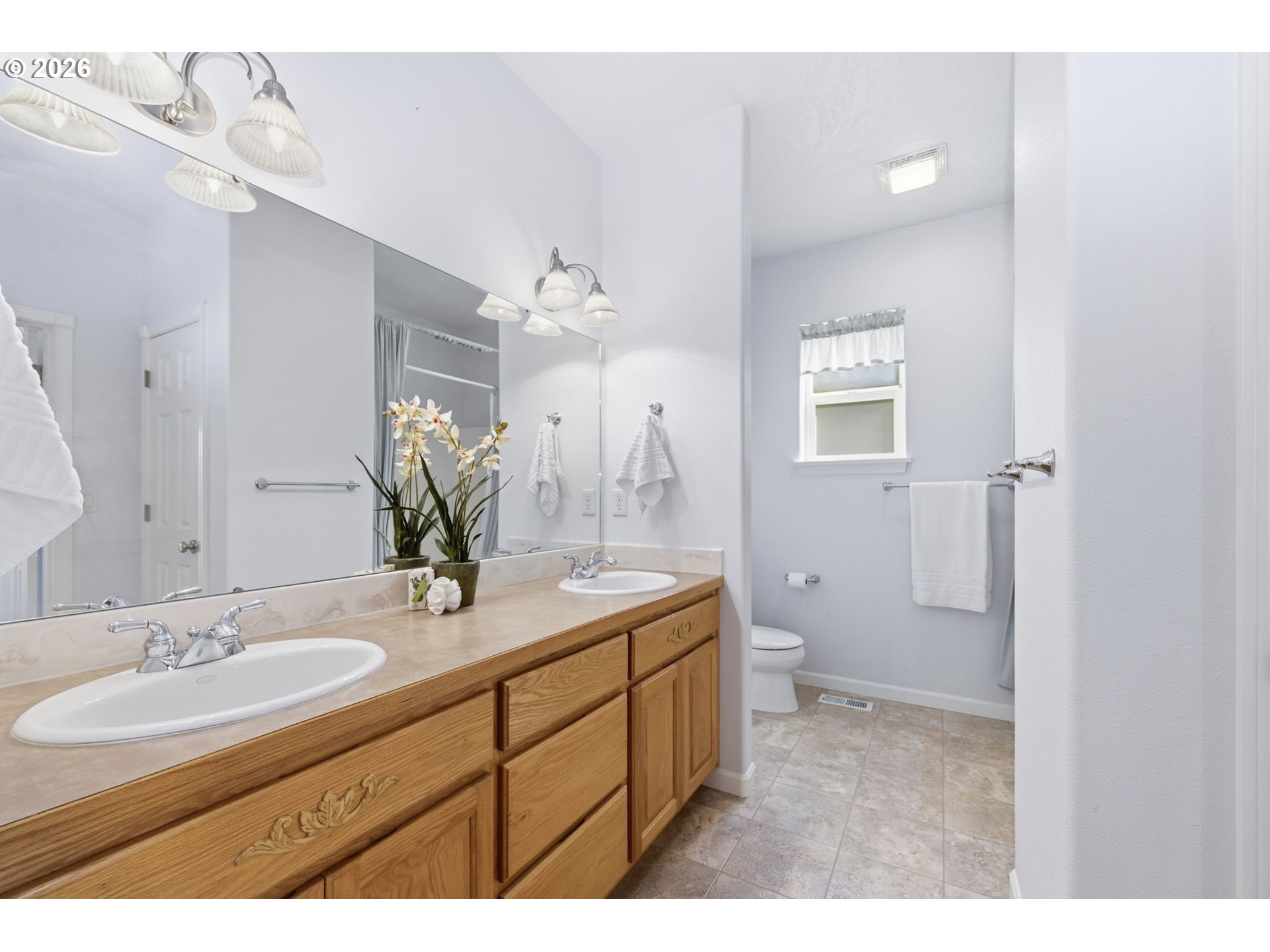 667 72nd Street Springfield, OR 97478 - Photo 28 of 40 a bathroom with a sink a toilet and a mirror