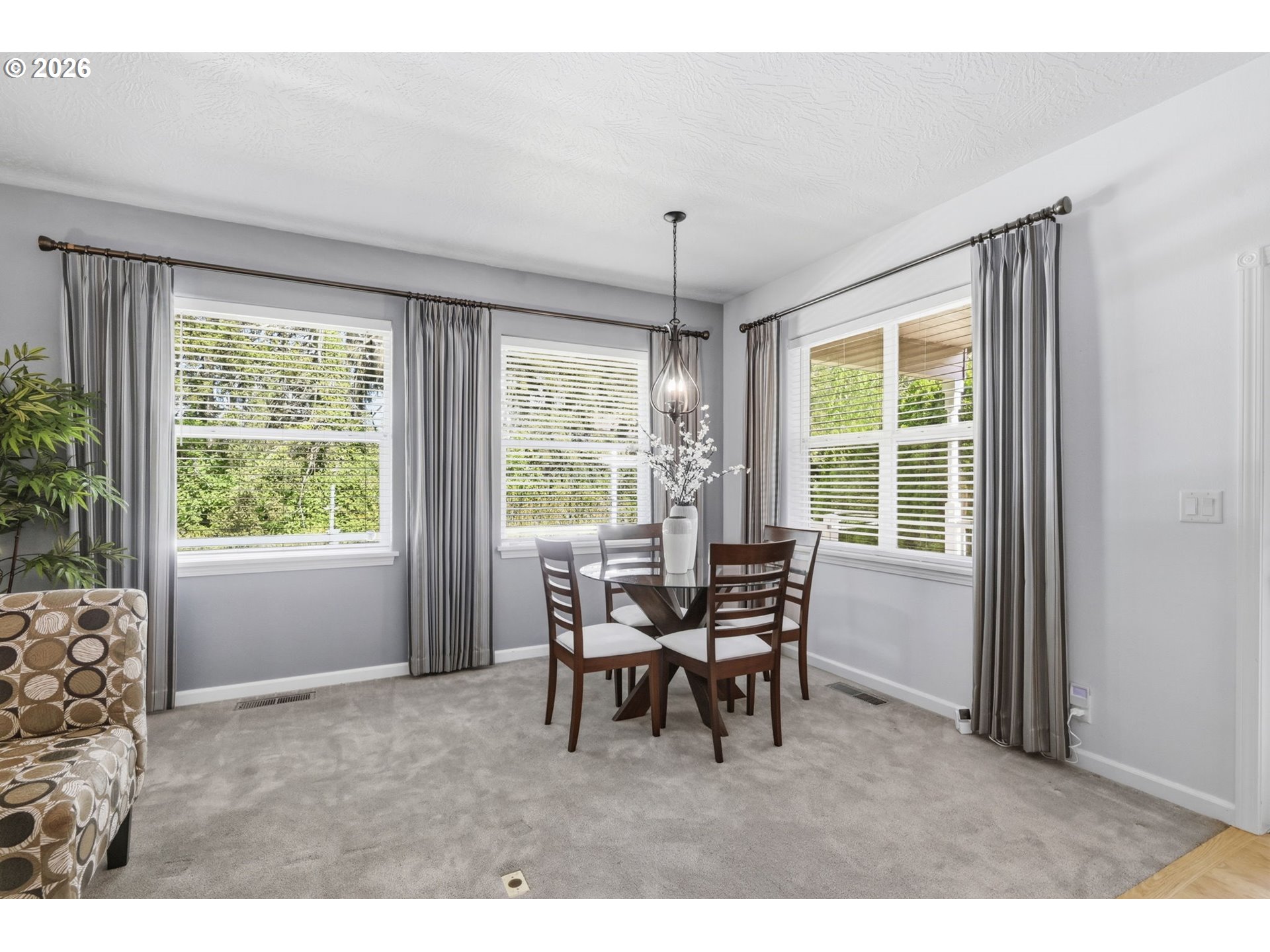 667 72nd Street Springfield, OR 97478 - Photo 10 of 40 a dining room with furniture a chandelier and a rug