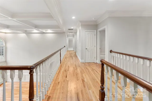 a view of staircase with wooden floor