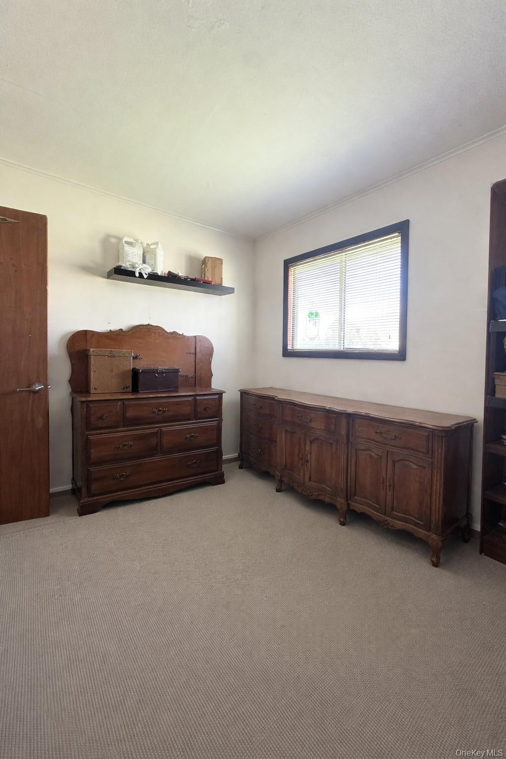 39 Barracuda Road East Quogue, NY 11942 - Photo 13 of 15 a view of room with furniture and window