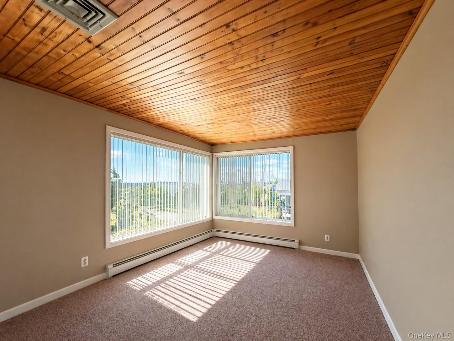 39 Barracuda Road East Quogue, NY 11942 - Photo 6 of 15 an empty room with windows