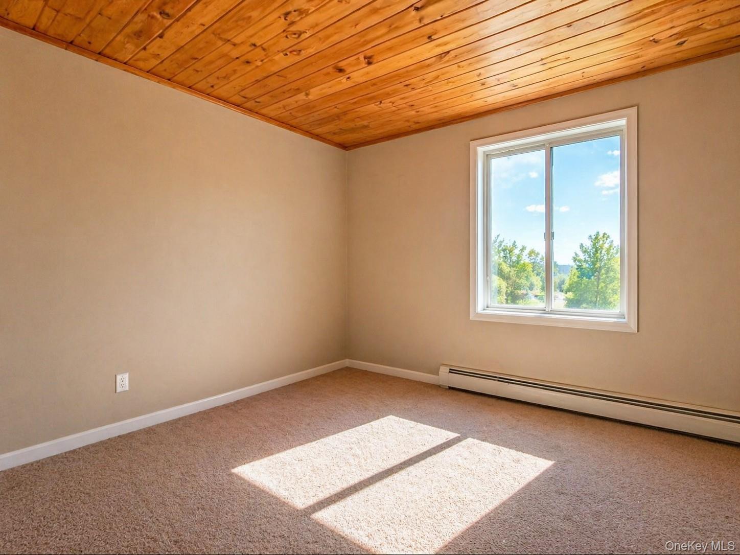 39 Barracuda Road East Quogue, NY 11942 - Photo 8 of 15 an empty room with a window