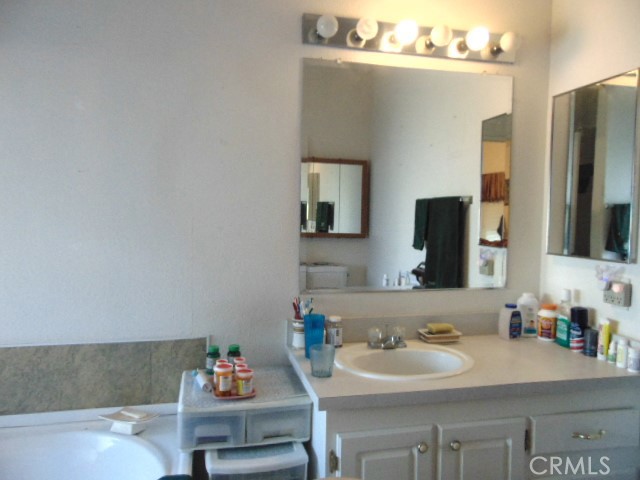 3835 Gardiner Ferry Road, Unit 62 Corning, CA 96021 - Photo 30 of 34 a bathroom with a sink and a mirror